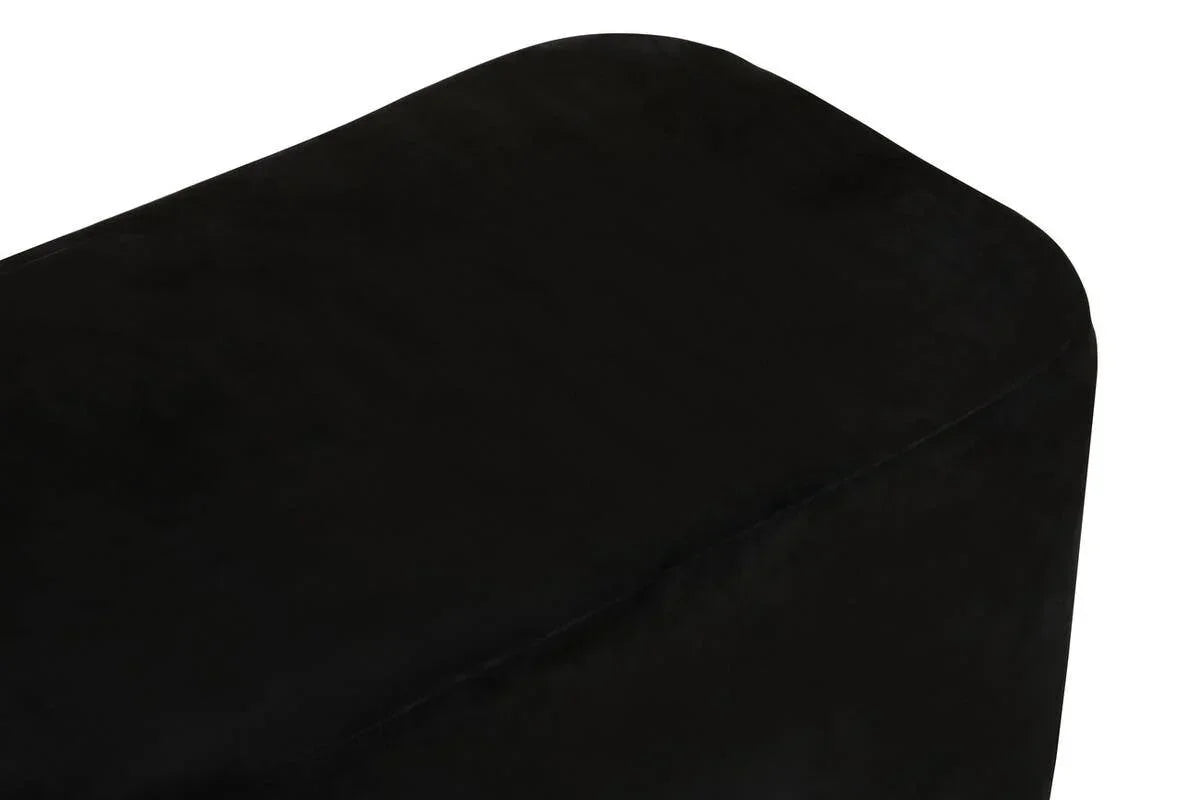 Close-up of black fabric ottoman corner with smooth upholstered surface