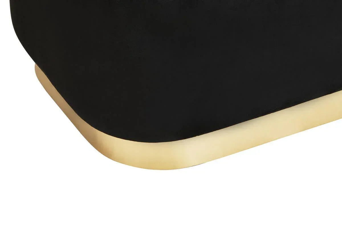 Black velvet furniture corner with gold metal base detail