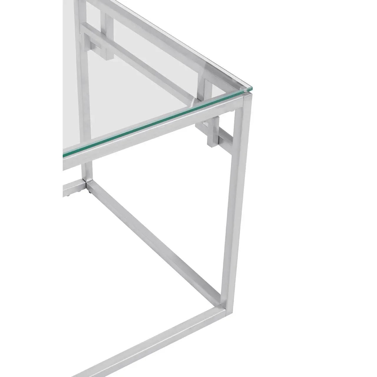 Closeup of glass top table with silver metal frame and modern geometric design