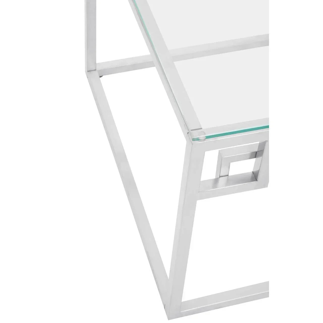 Glass top table with chrome frame and geometric leg detail, corner angle view