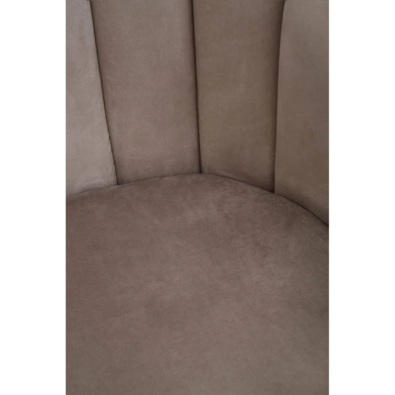 Close-up of taupe velvet chair seat and backrest with curved panelling