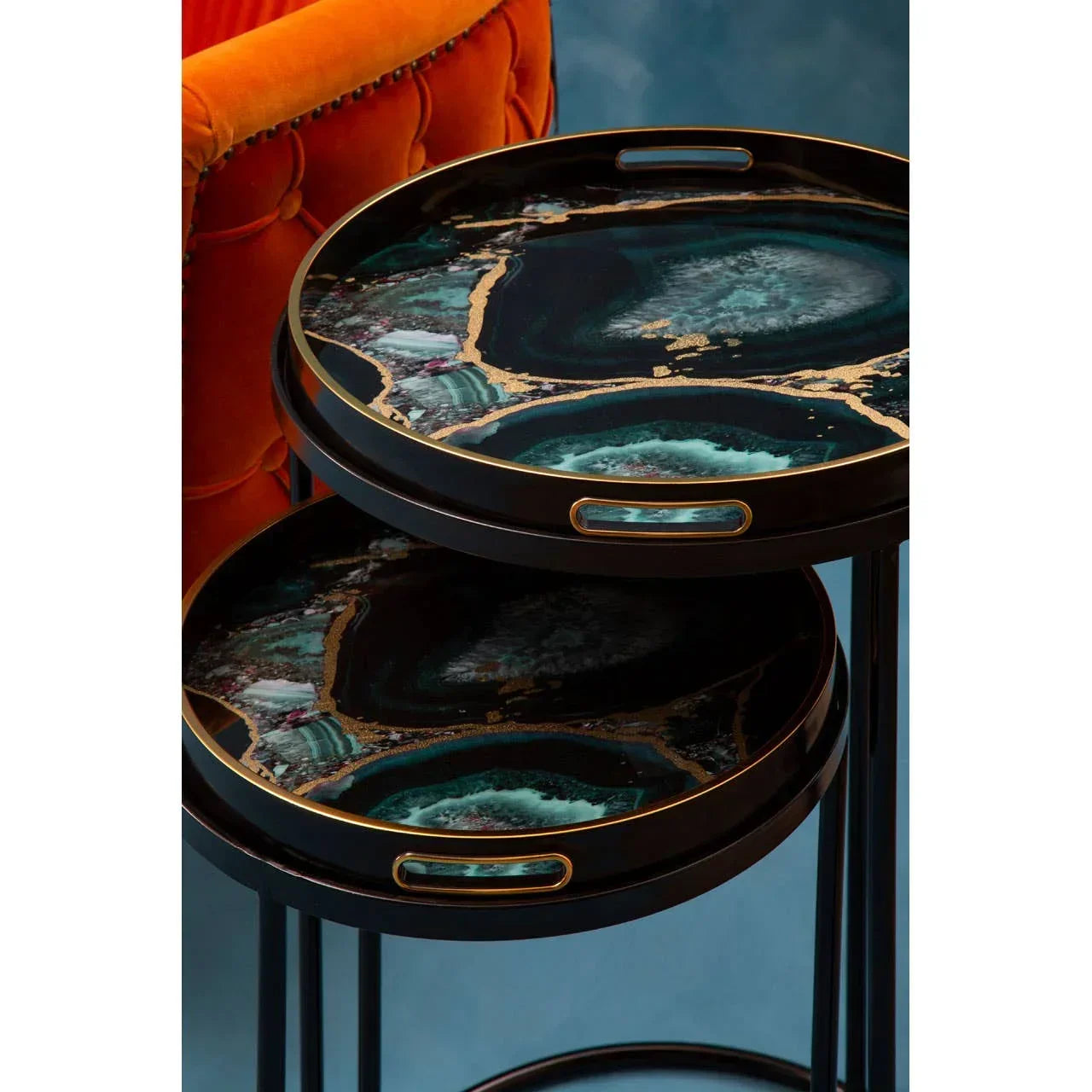 Set of two round nesting side tables with black and gold marble pattern tops
