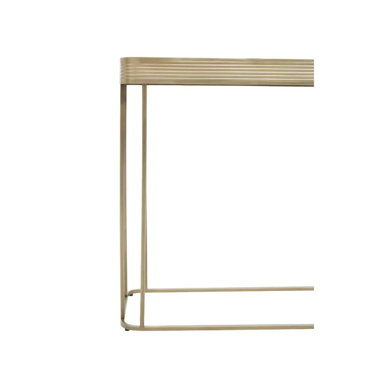 Gold metal console table with slim legs and ribbed edge detail, partial side view