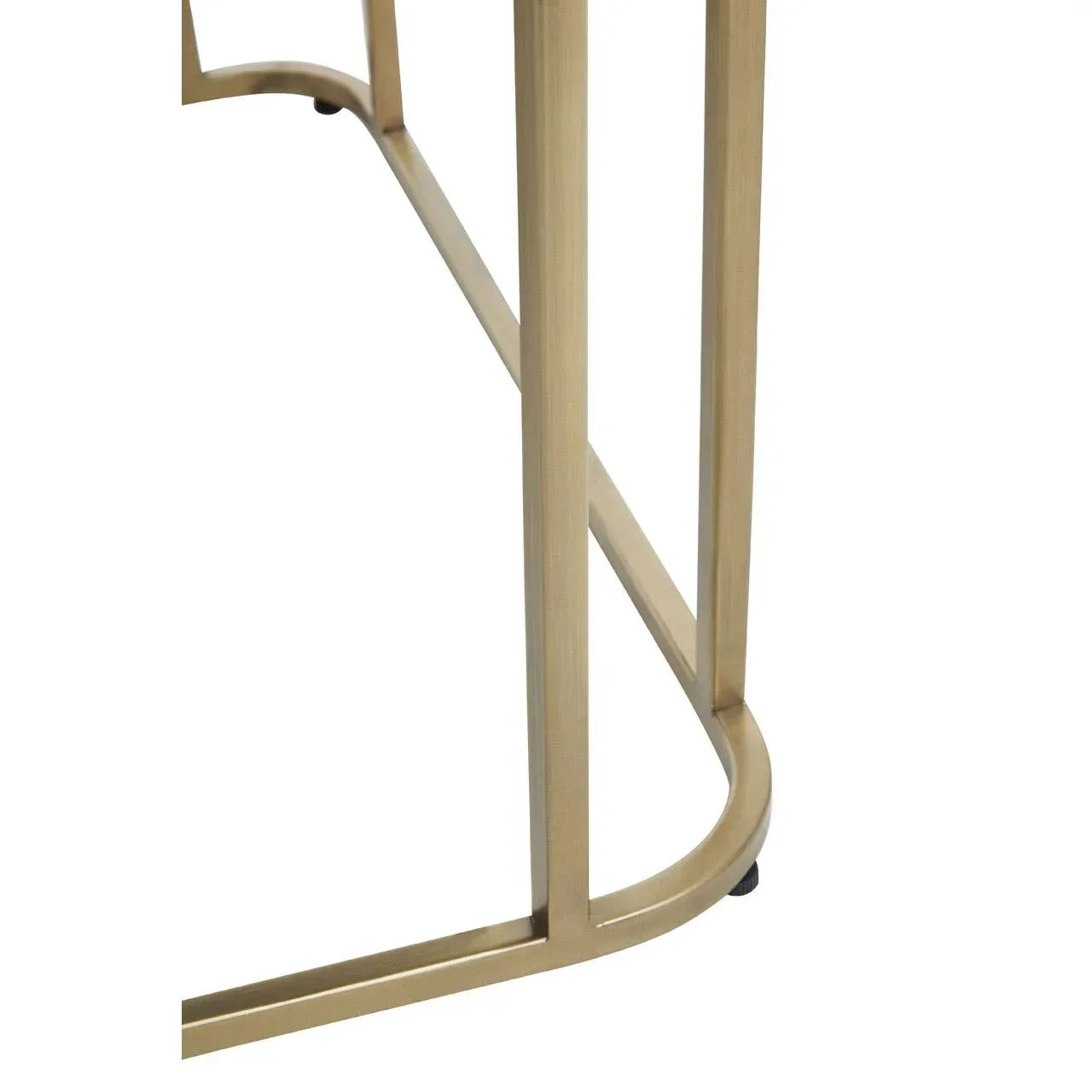 Gold metal table leg with curved base detail on white background