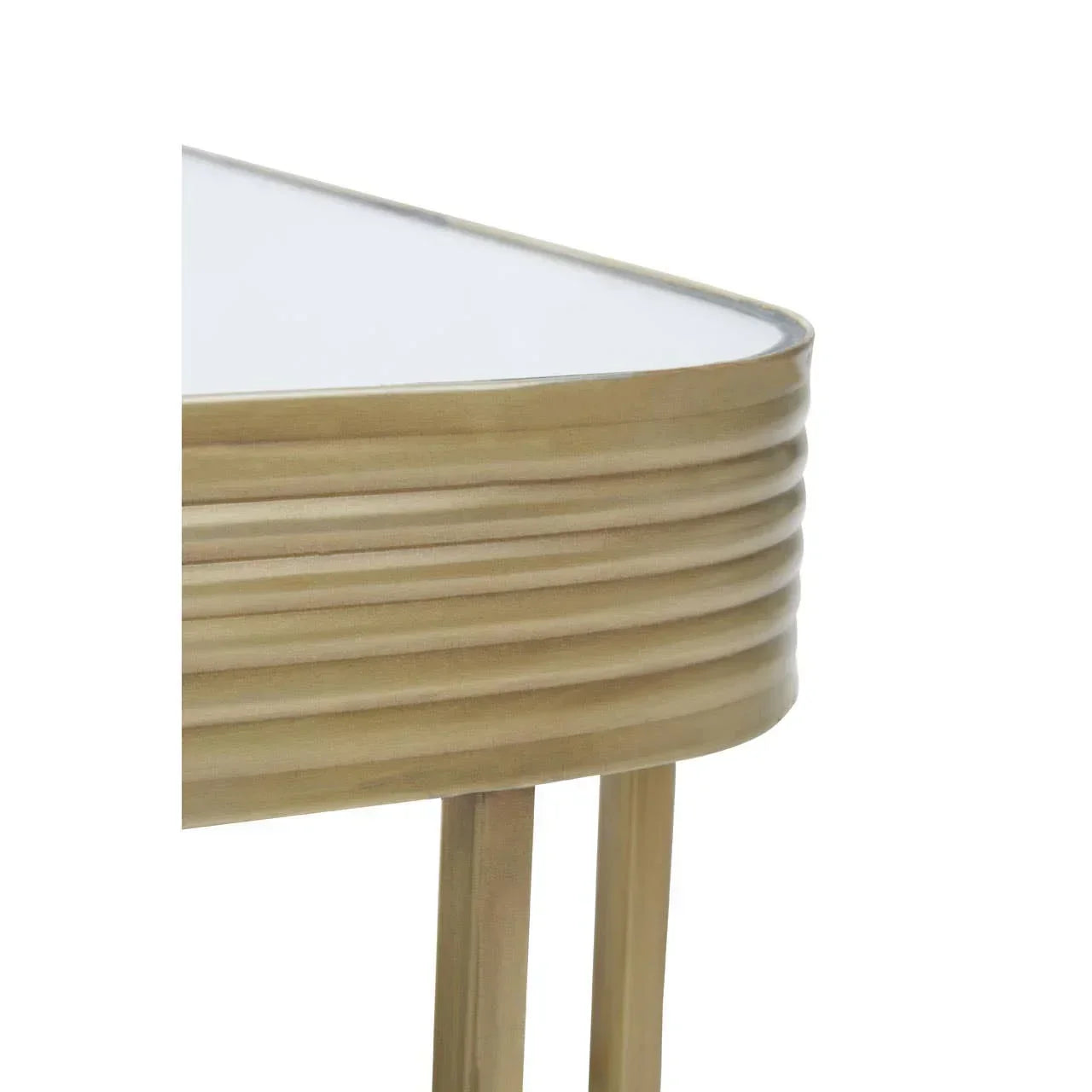 Closeup of gold metal side table with fluted edge and glass top
