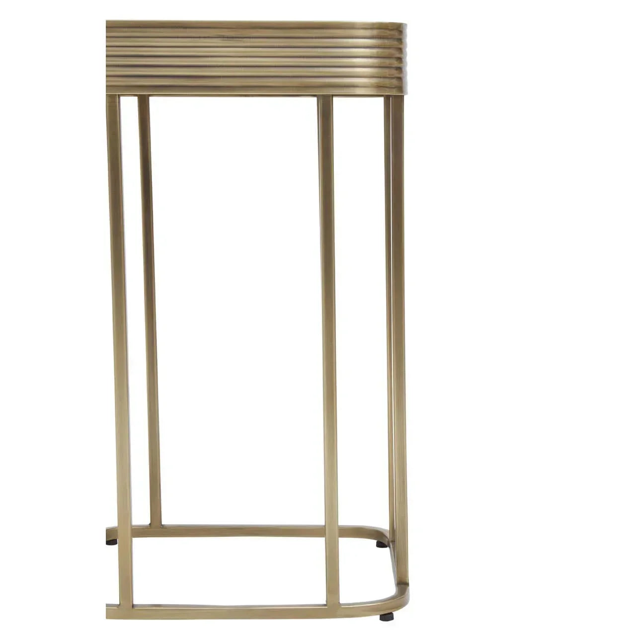 Gold metal side table with ribbed detailing and slim legs, close side angle view