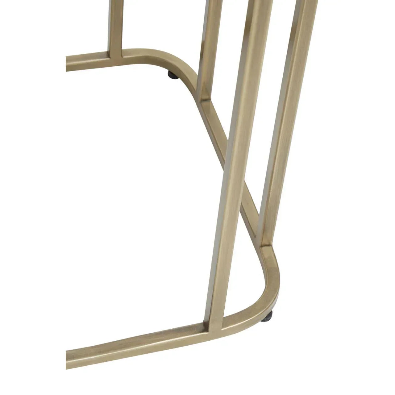 Close-up of gold metal table base with curved edges and minimalist design