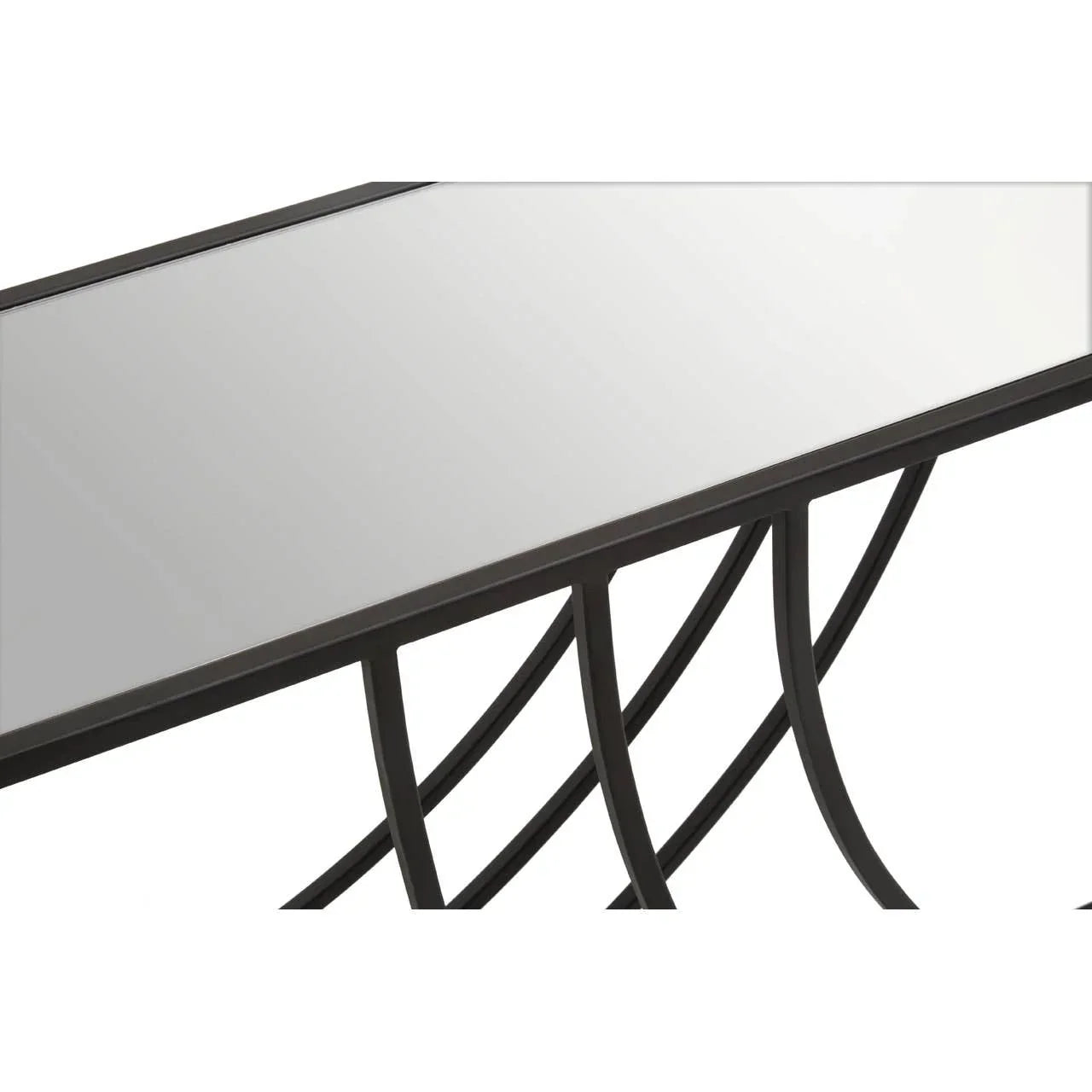 Rectangular glass top table with black metal curved legs, close-up corner view