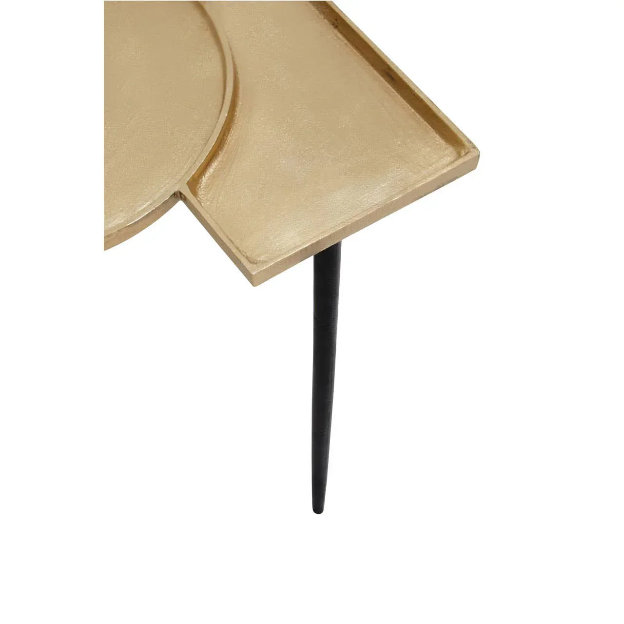 Gold metal side table corner with geometric top and black tapered leg