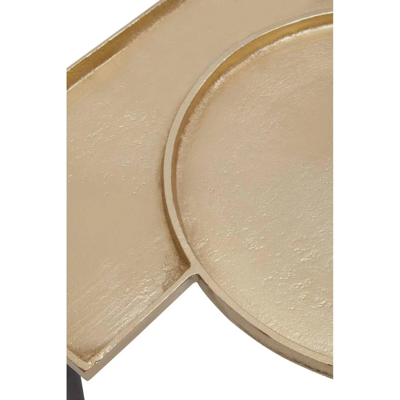 Closeup of textured gold metal table top with geometric design