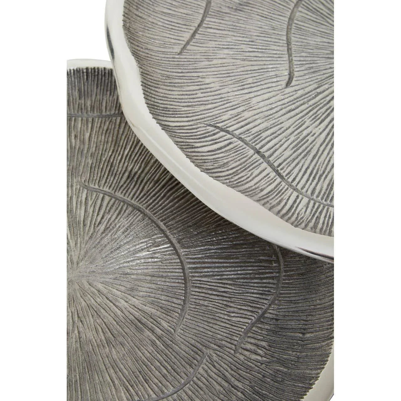 Round decorative trays with textured grey surface and raised edges, stacked together