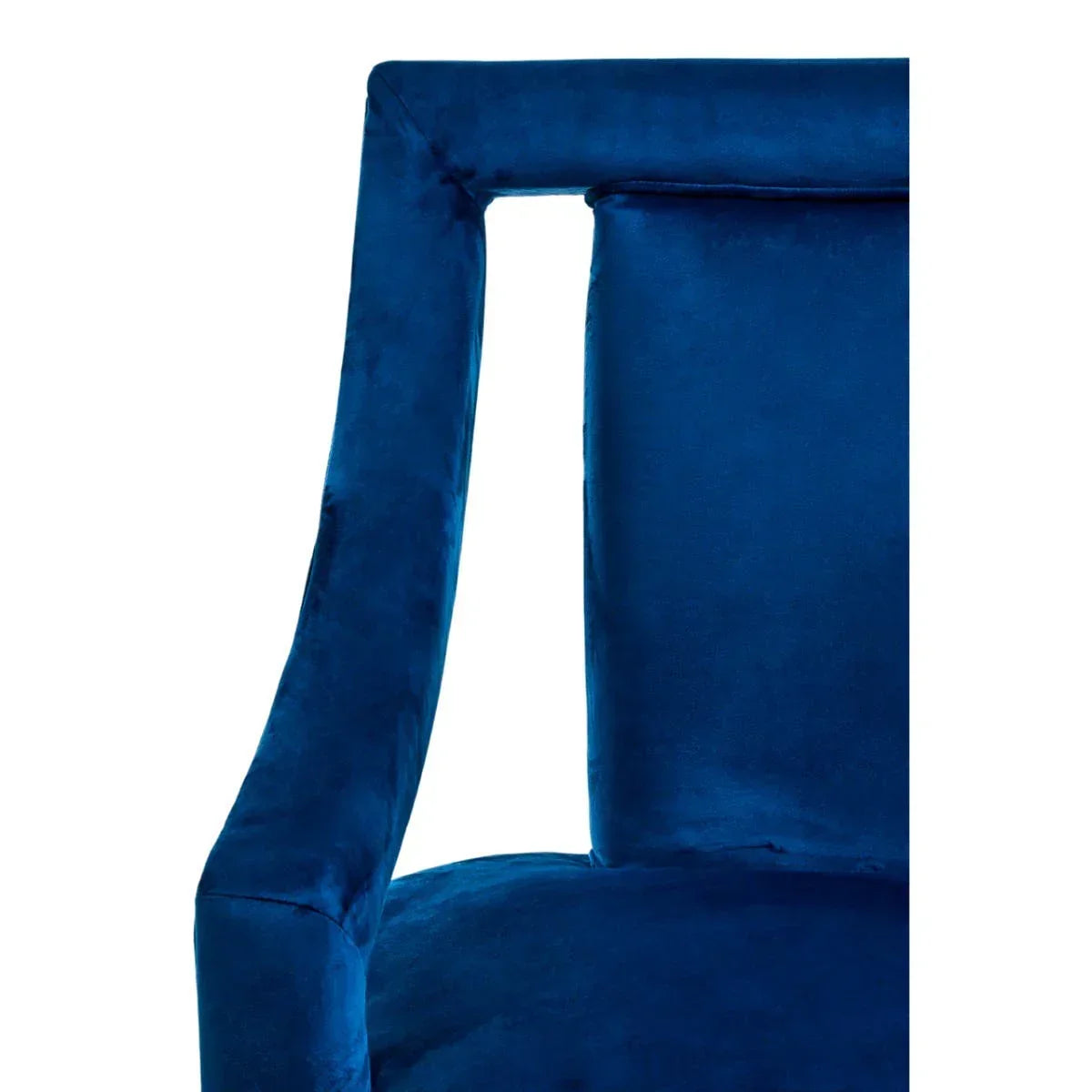 Close-up of blue velvet dining chair backrest and armrest upholstery