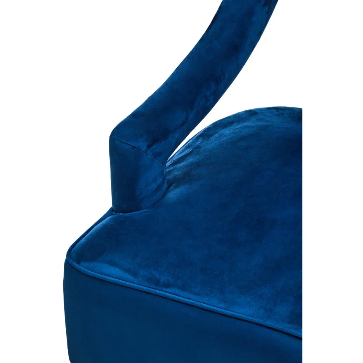 Close-up of blue velvet armchair seat and armrest upholstery
