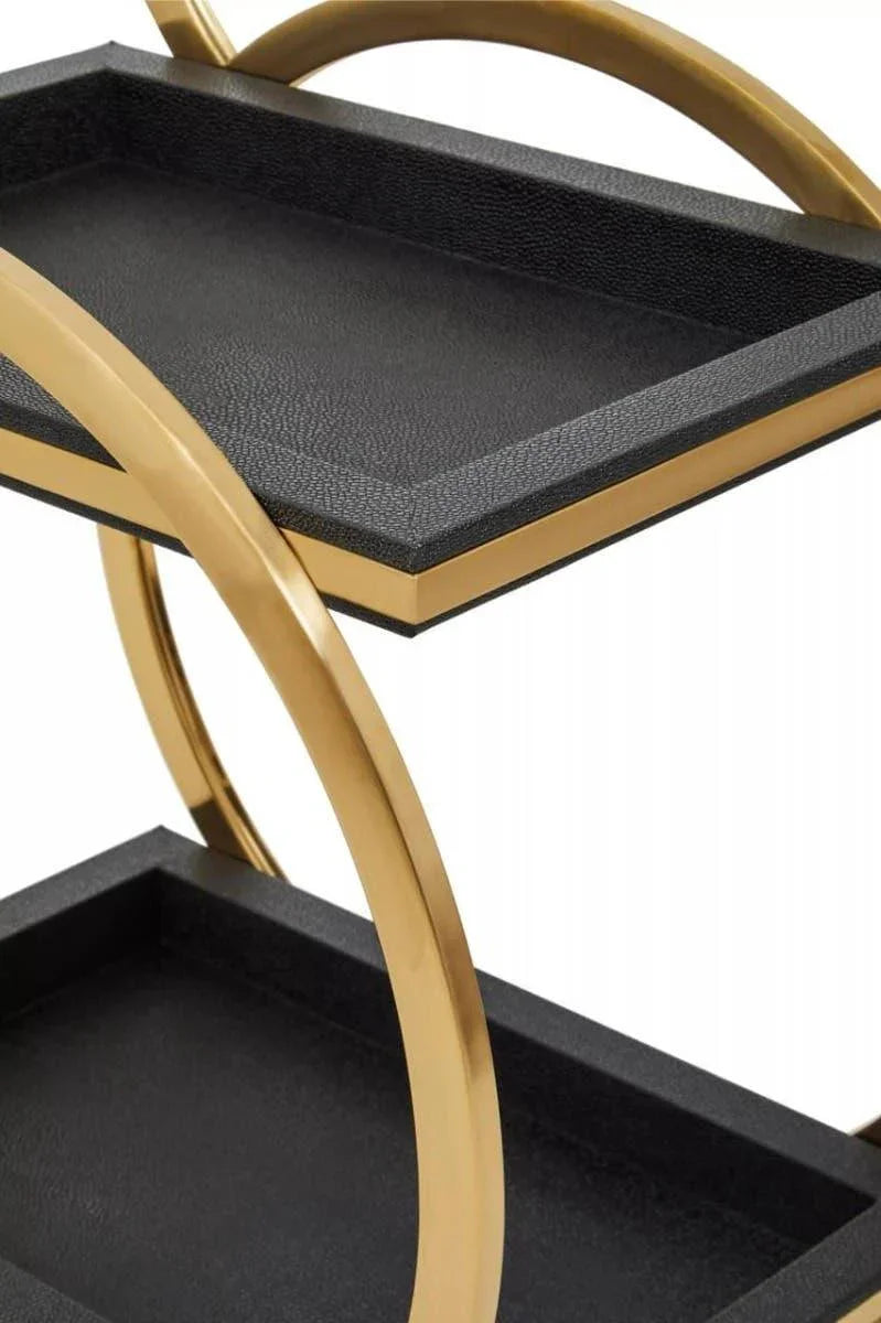 Black and gold metal side table with two rectangular trays and curved handles