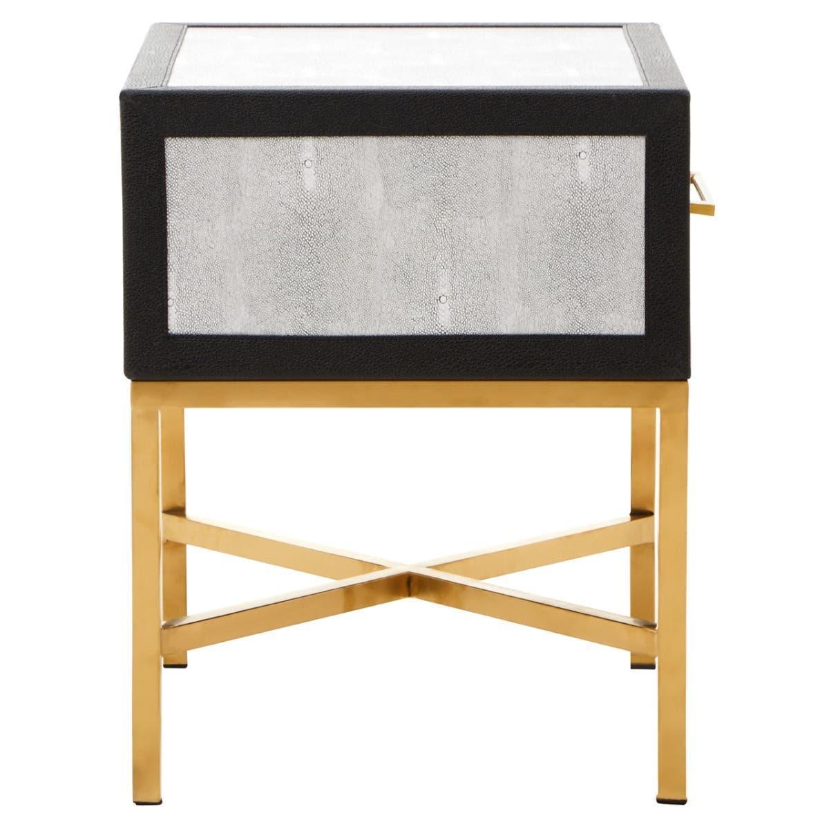 Modern side table with black frame, gold metal legs, and faux shagreen textured panel front