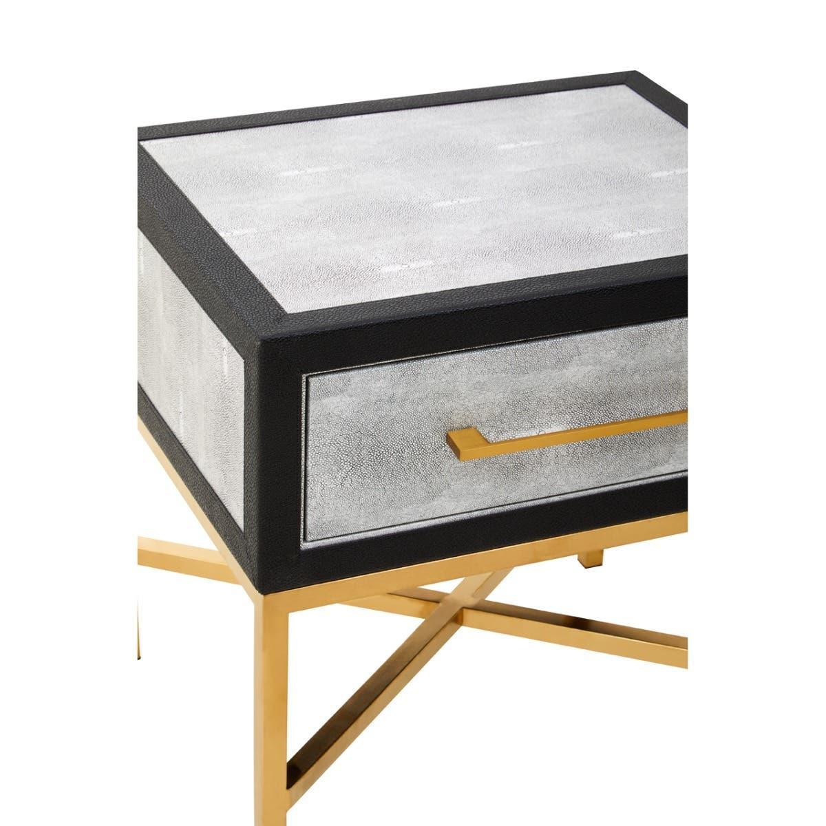 Modern side table with gold metal legs, faux shagreen drawer, and sleek gold handle