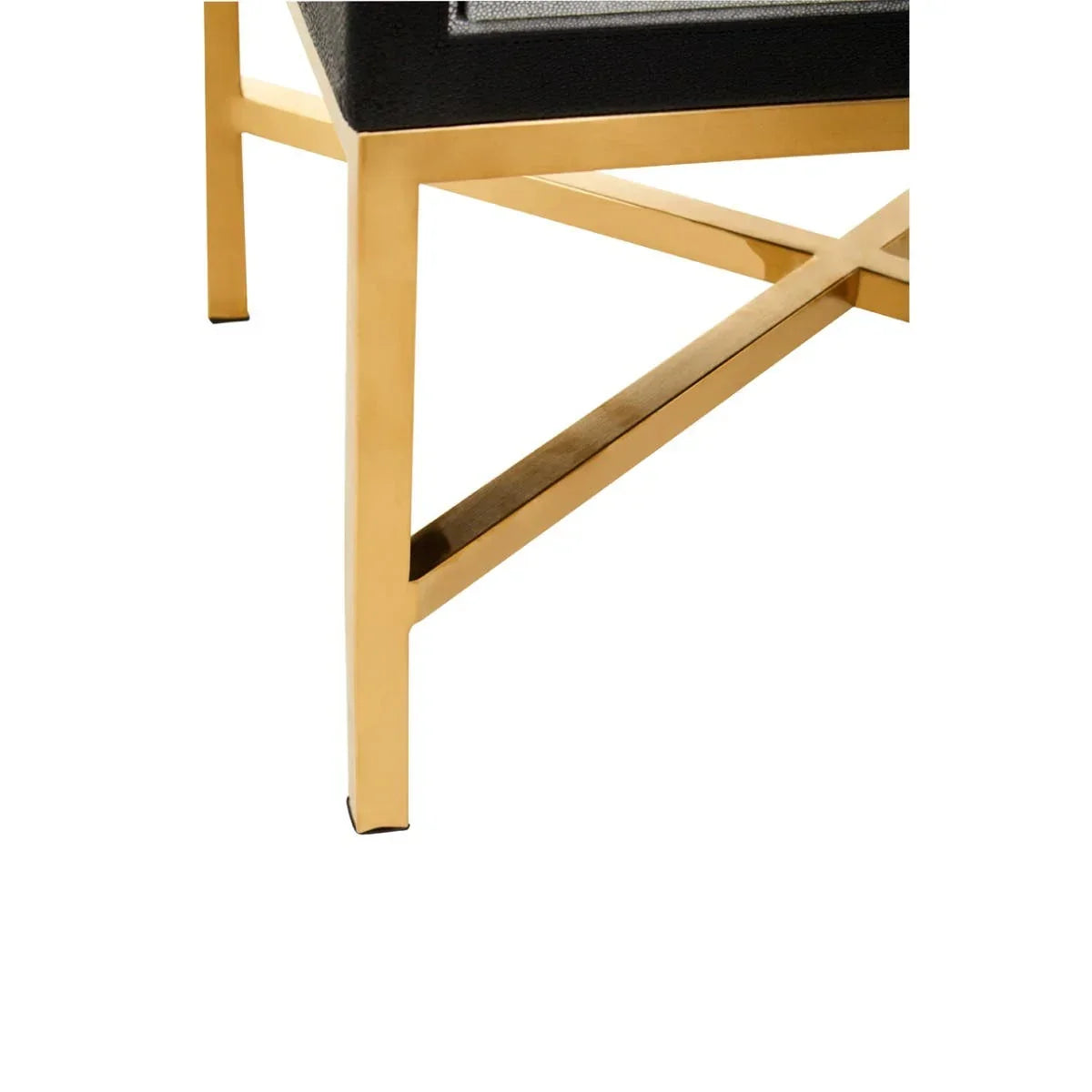 Gold metal chair leg with black upholstered seat and cross-brace support, close-up