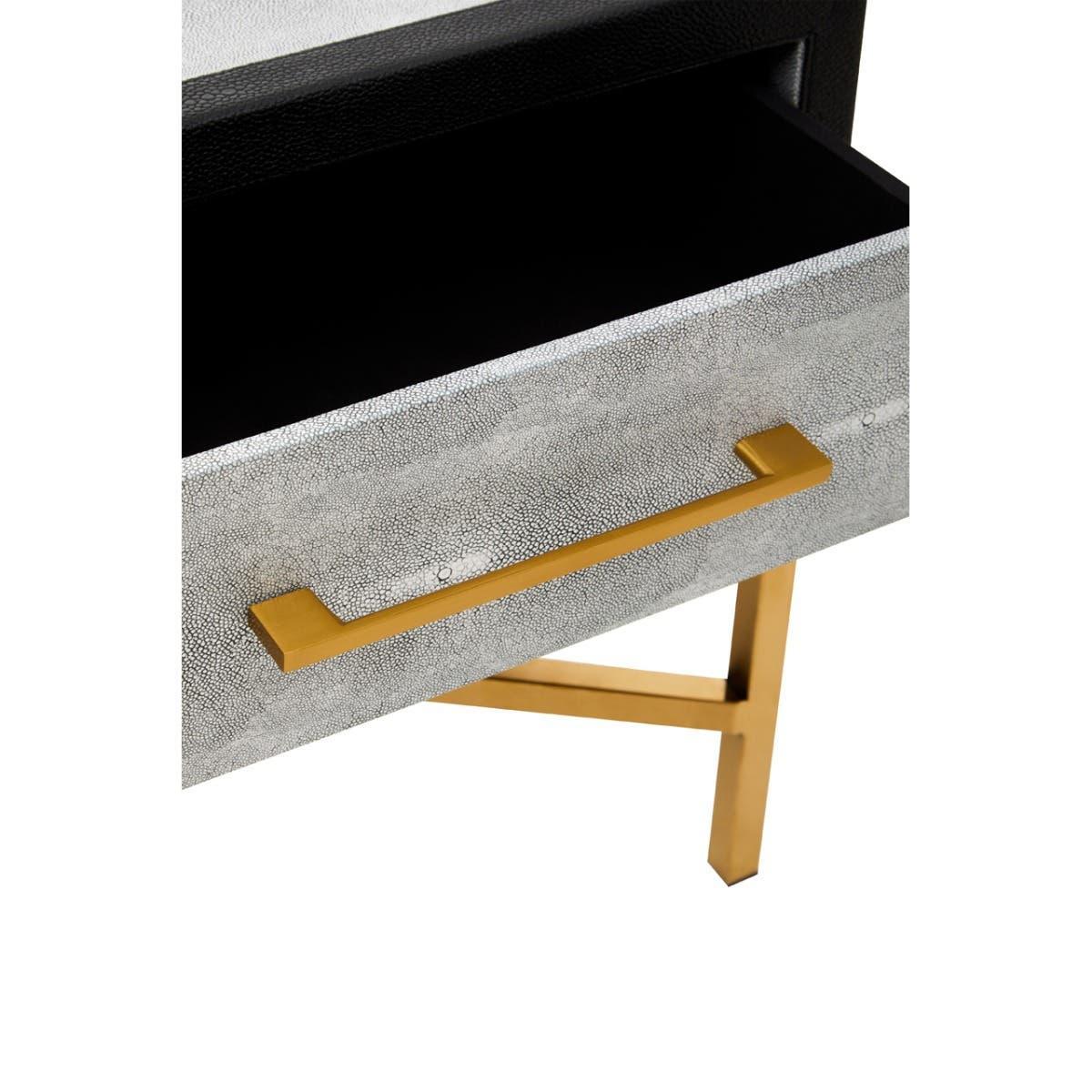 Textured grey drawer with gold handle and gold metal legs, close-up view