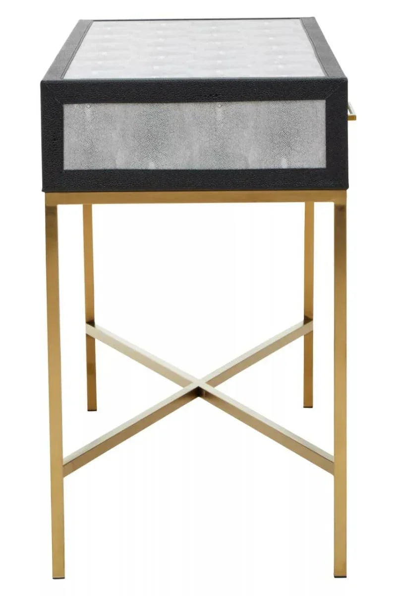 Modern side table with gold metal legs and grey faux leather drawer front, front view