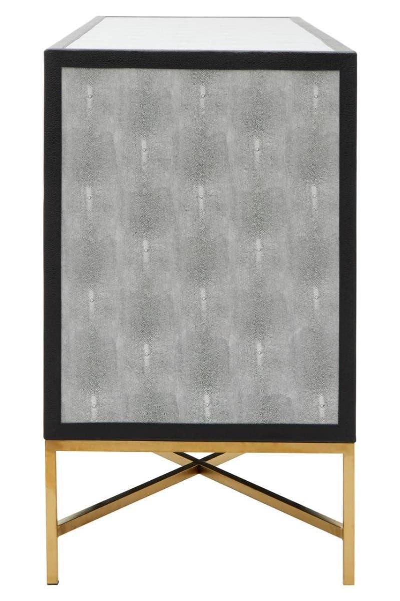 Side view of grey panel sideboard with black trim and gold metal cross legs