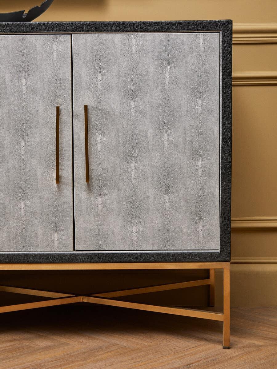 Modern sideboard cabinet with grey textured doors and gold metal base