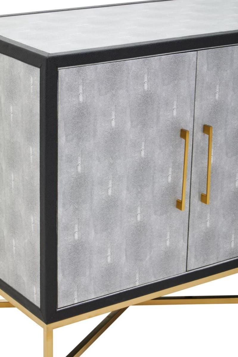 Grey sideboard with gold metal handles and legs, textured finish, close-up front view