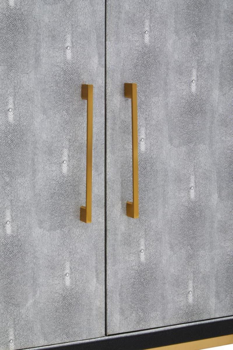 Grey textured cabinet doors with gold handles, modern furniture close-up