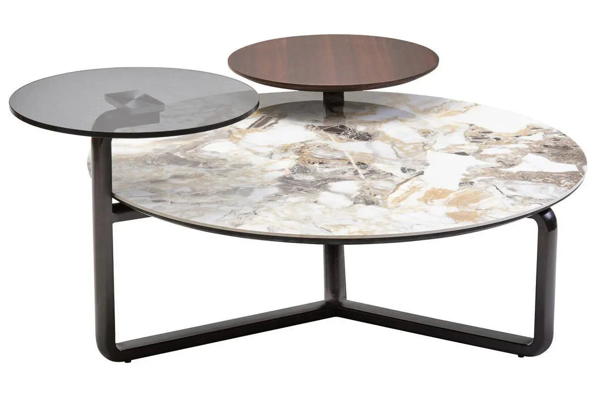 Modern marble coffee table with round glass, wood, and stone surfaces on black metal legs