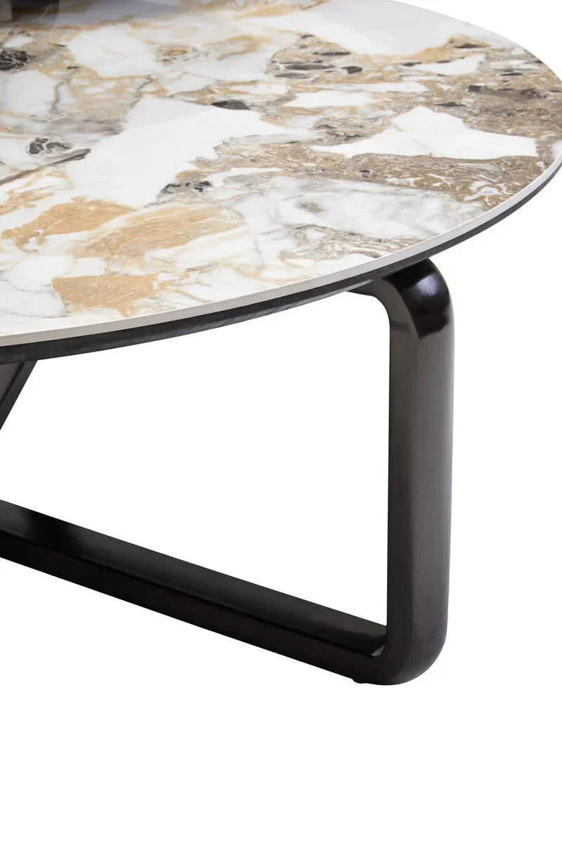 Round marble coffee table with black metal frame, close-up of top and leg details