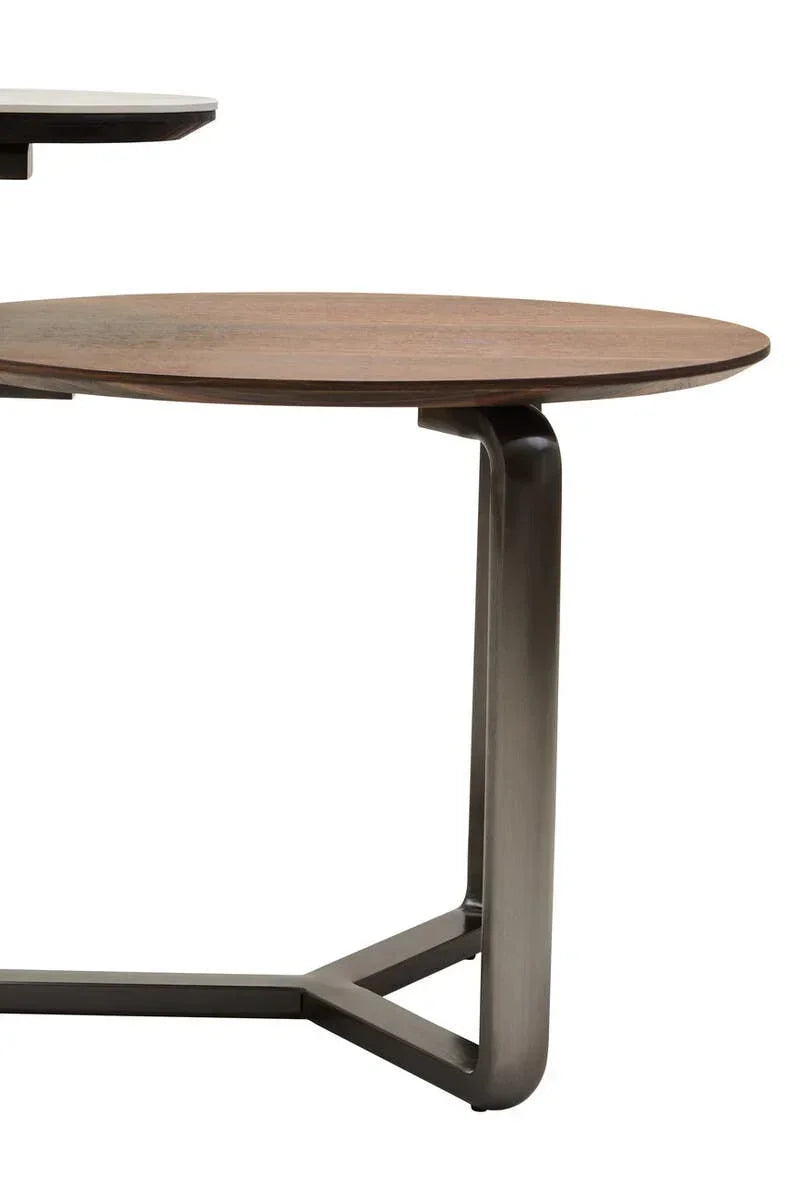 Round wood coffee table with metal base, modern design, close-up side view