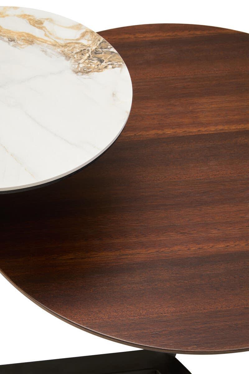 Round coffee table with marble and wood effect tops, close-up of overlapping surfaces