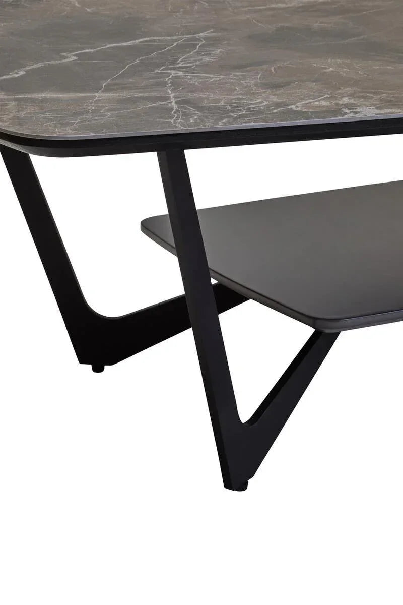 Marble effect coffee table with black metal legs and lower shelf, close up corner view
