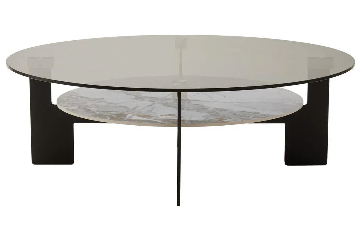 Round glass coffee table with black metal legs and marble shelf