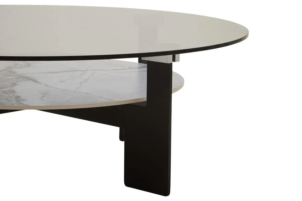 Round glass coffee table with black legs and marble effect lower shelf