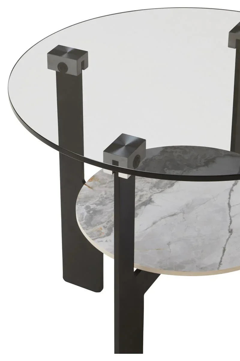 Round glass coffee table with black legs and lower marble effect shelf