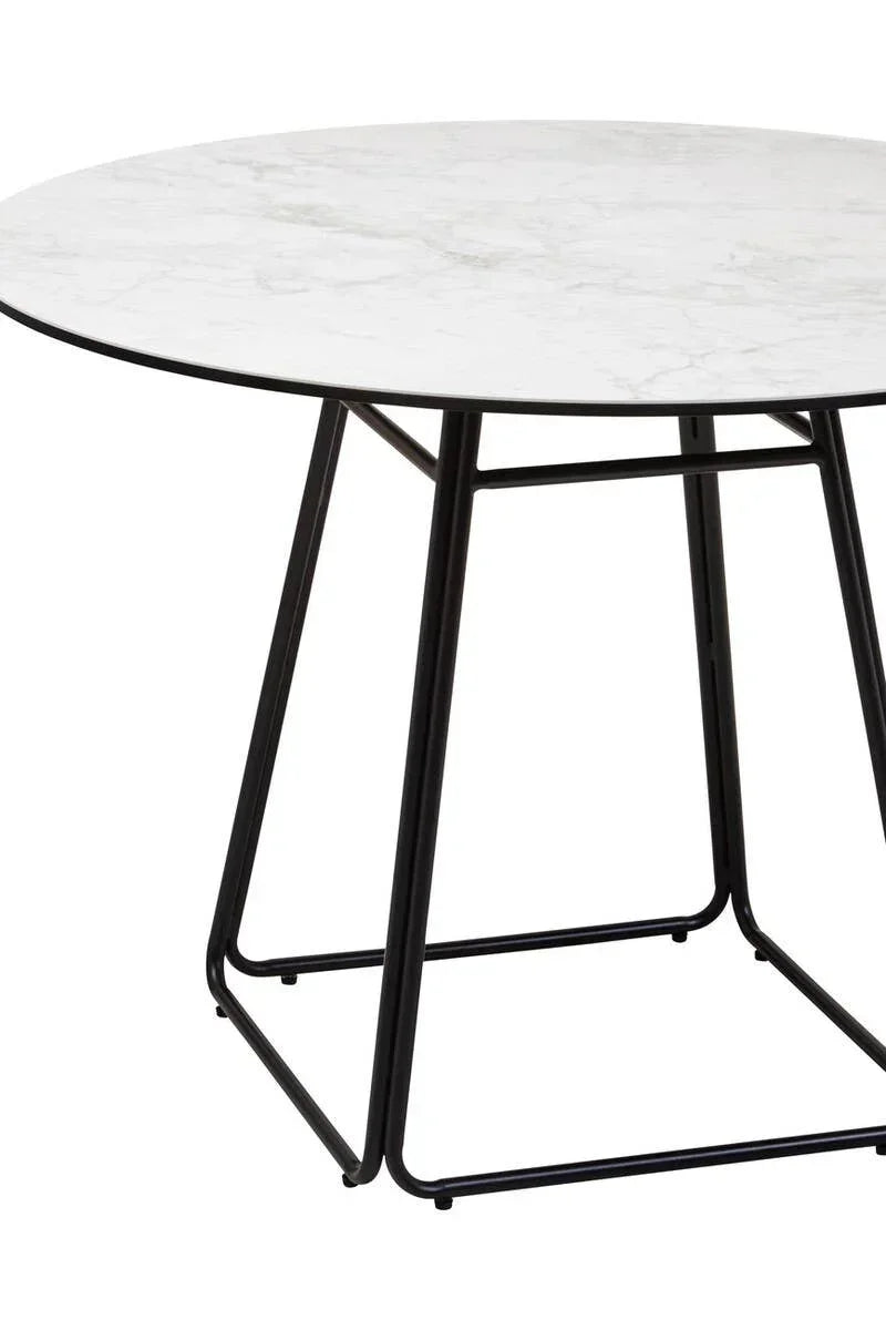Round dining table with white marble top and black metal legs
