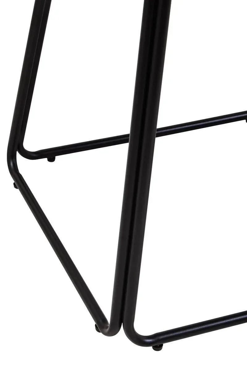 Black metal furniture legs with triangular base design, close-up view