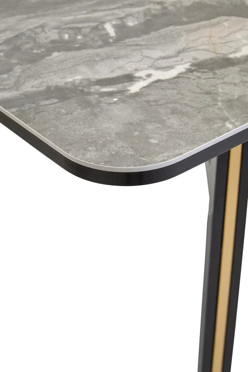 Grey marble effect dining table corner with metal leg and gold accent