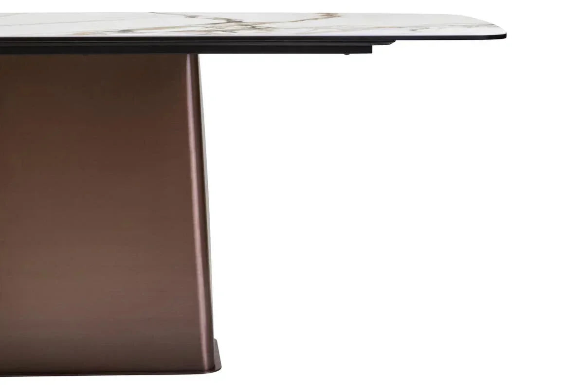 Modern dining table with marble effect top and bronze pedestal base, side angle view