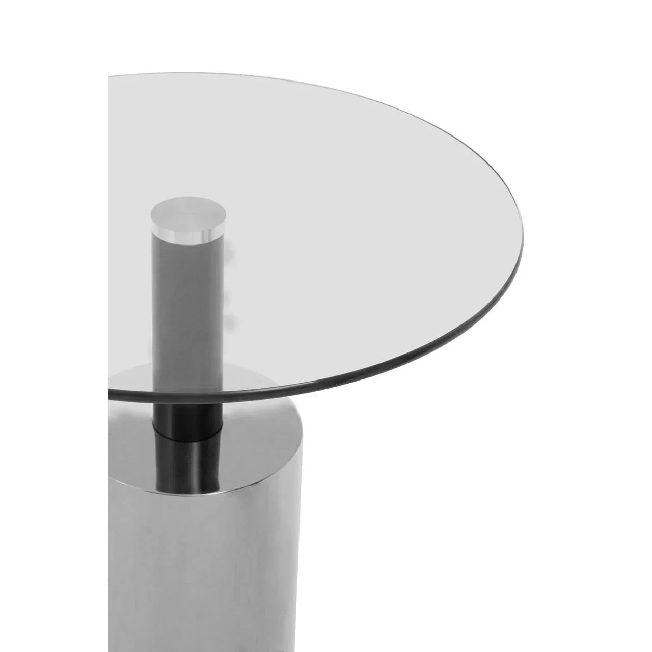 Round glass top dining table with stainless steel cylindrical base, close-up view
