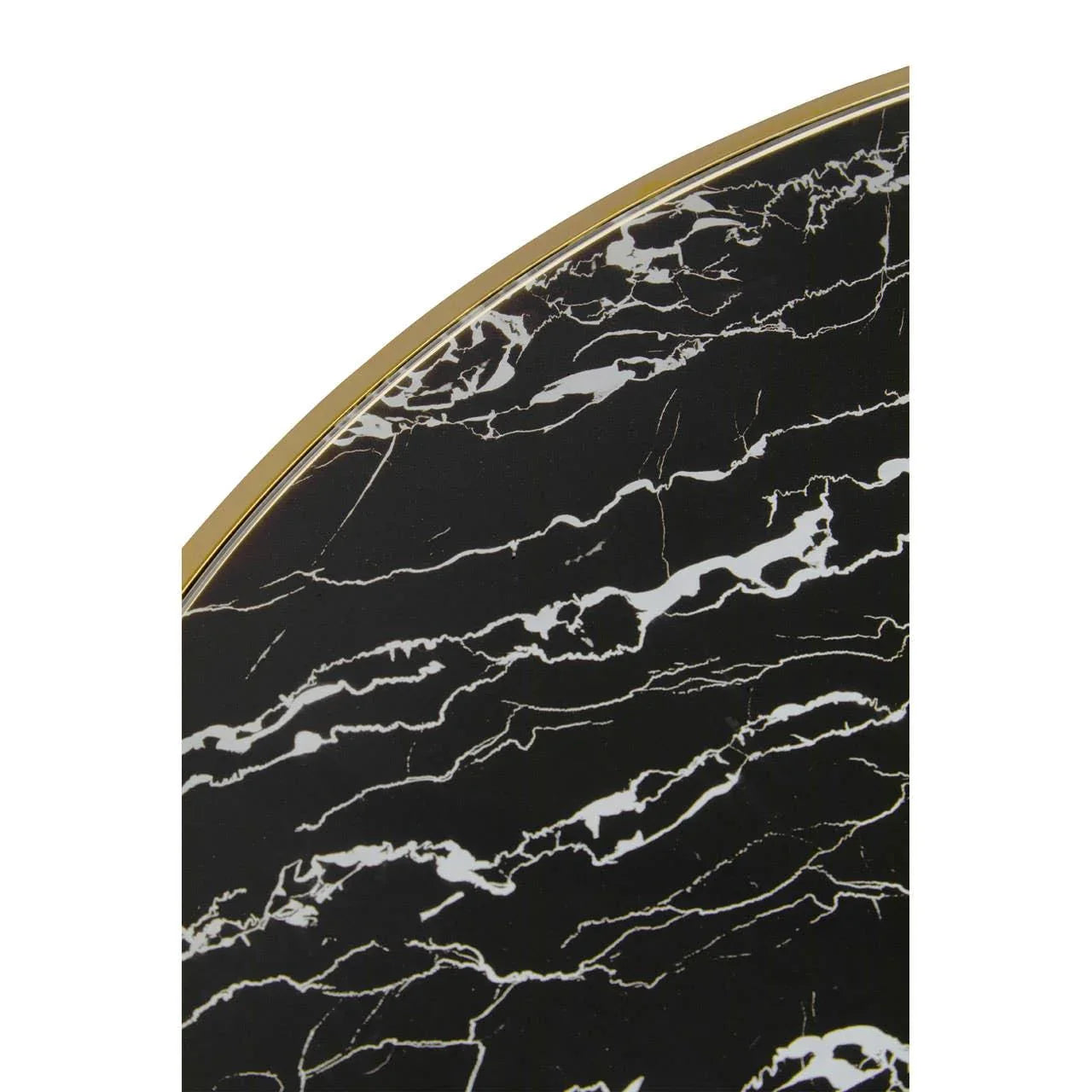 Black marble tabletop with gold edge detail close up