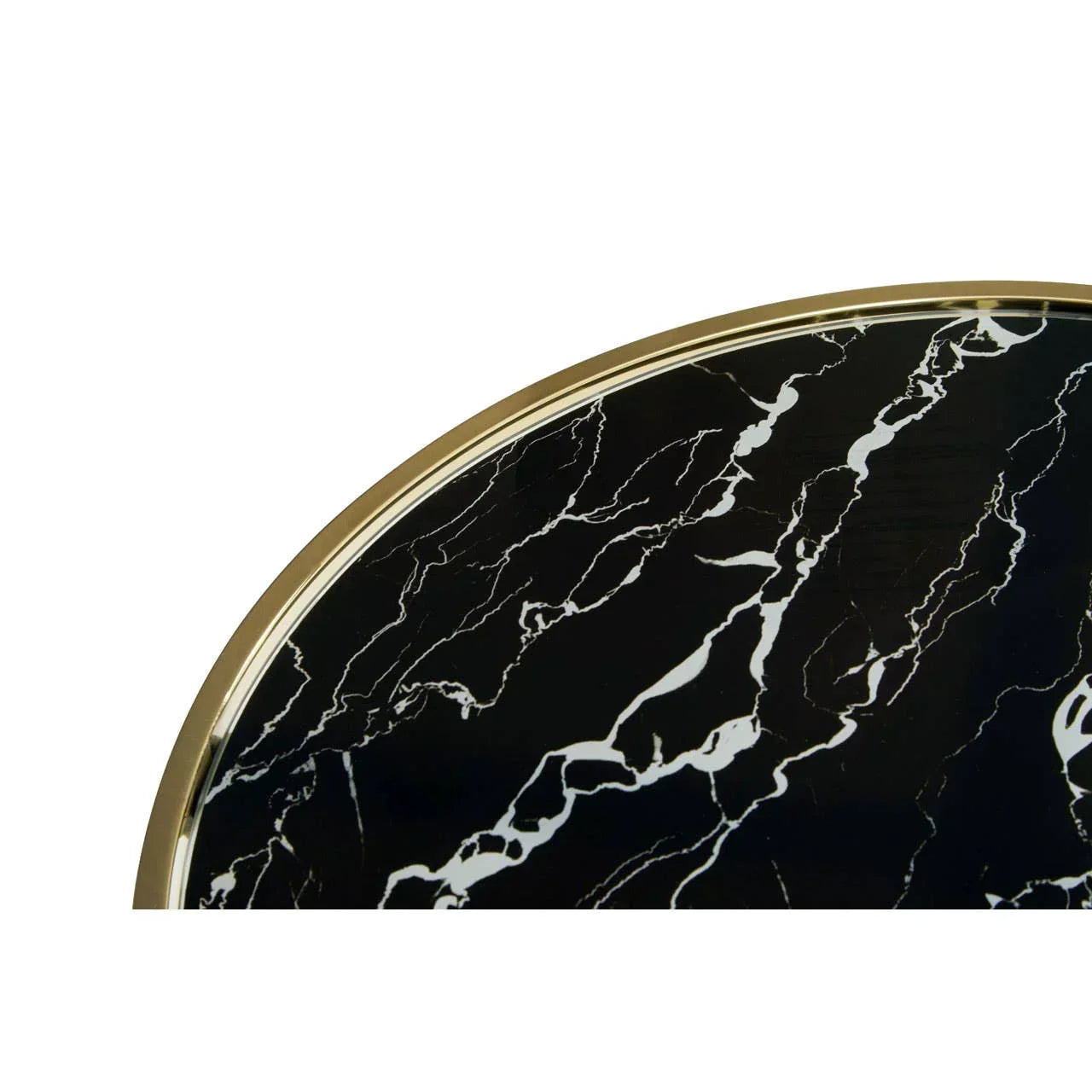 Round black marble table top with gold trim, close detail of veined surface