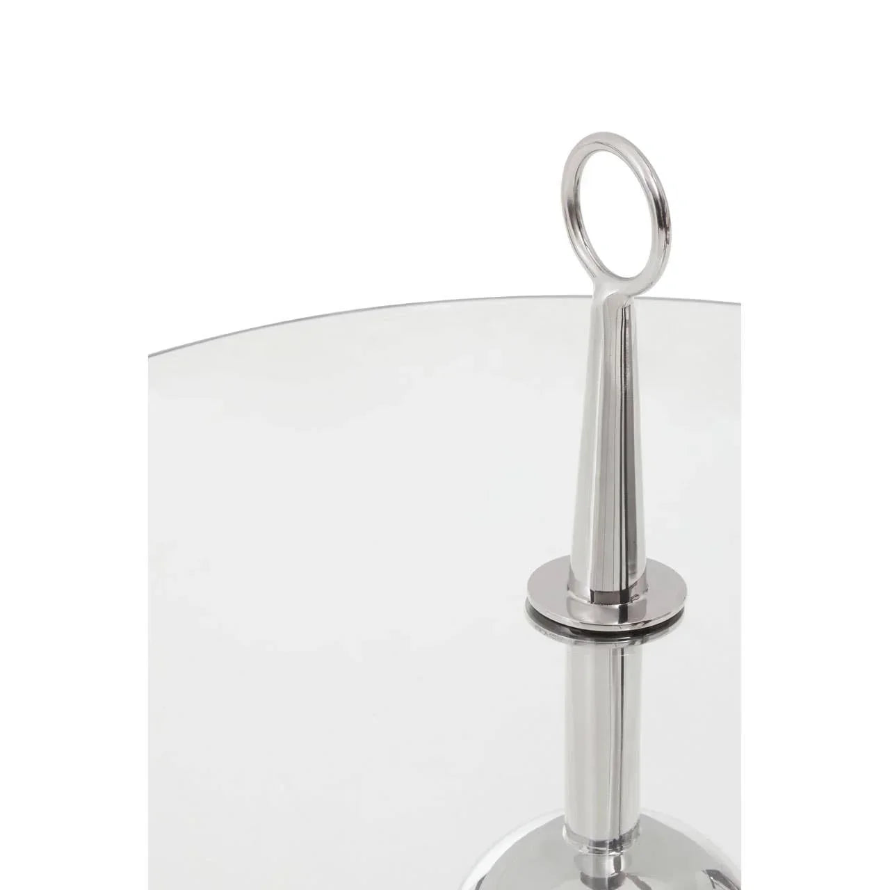 Round glass coffee table with a chrome metal base and loop handle detail