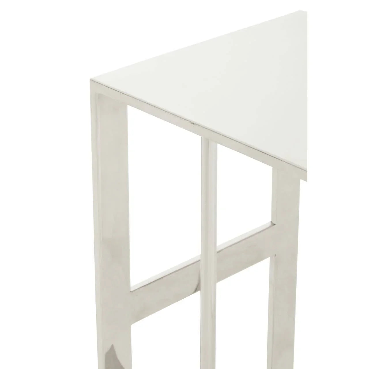 Modern side table with white top and chrome metal legs close up
