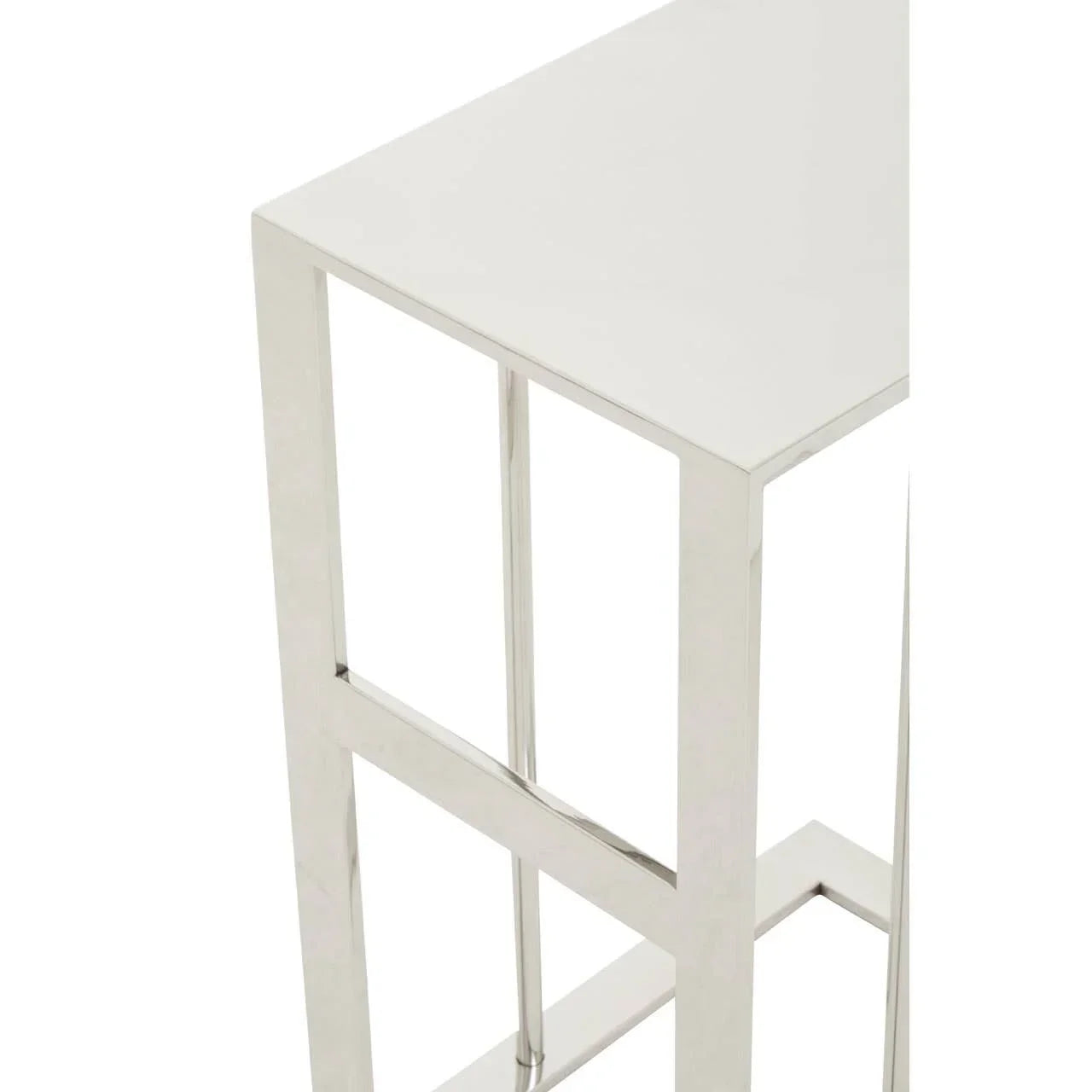 Chrome metal side table with square white top and geometric frame, corner detail view
