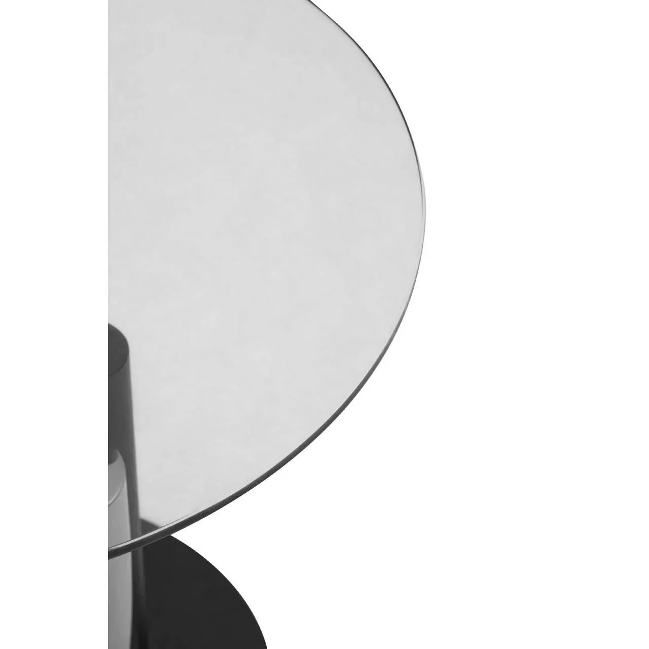 Round glass dining table top with black metal base detail