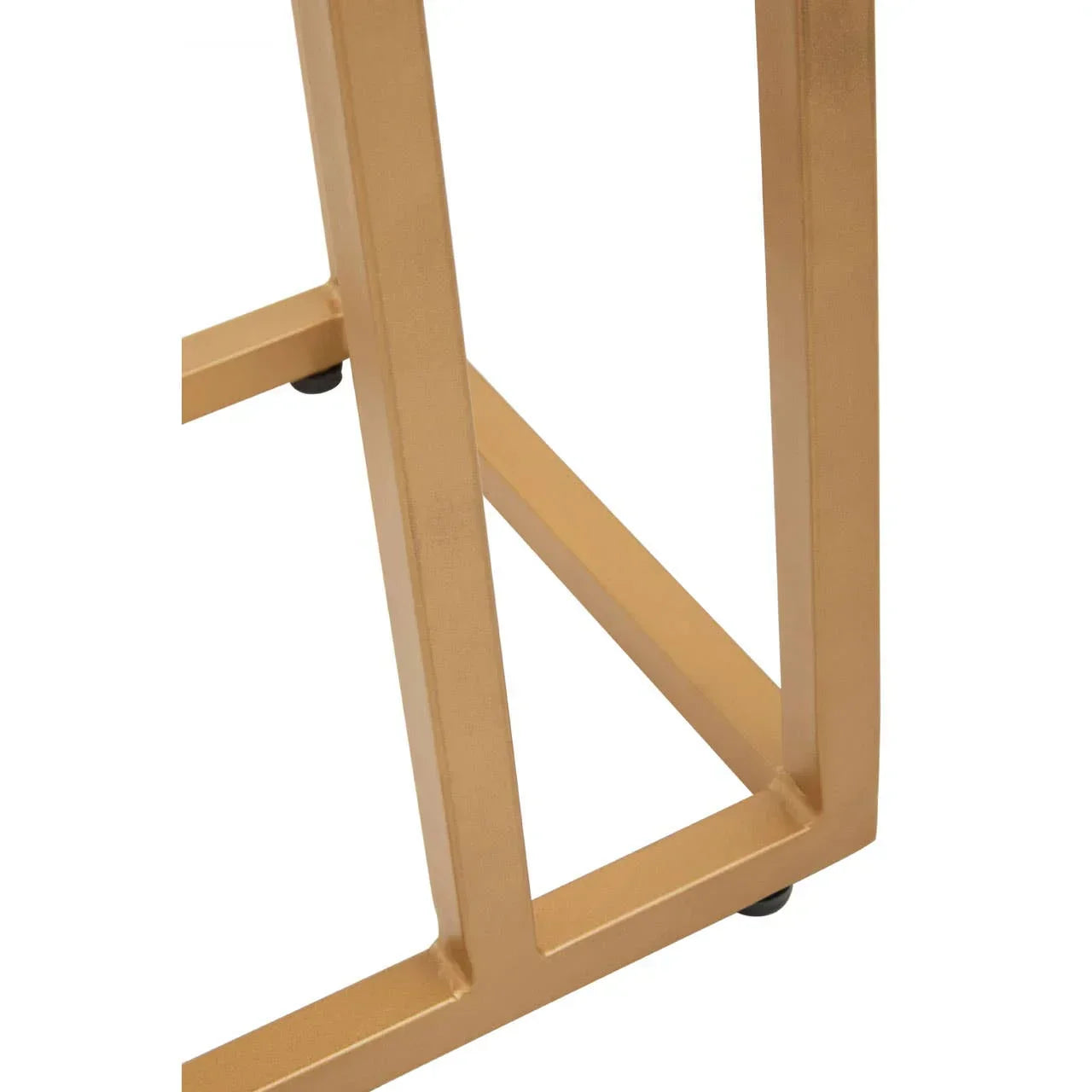 Gold metal table leg with geometric design and smooth finish close-up