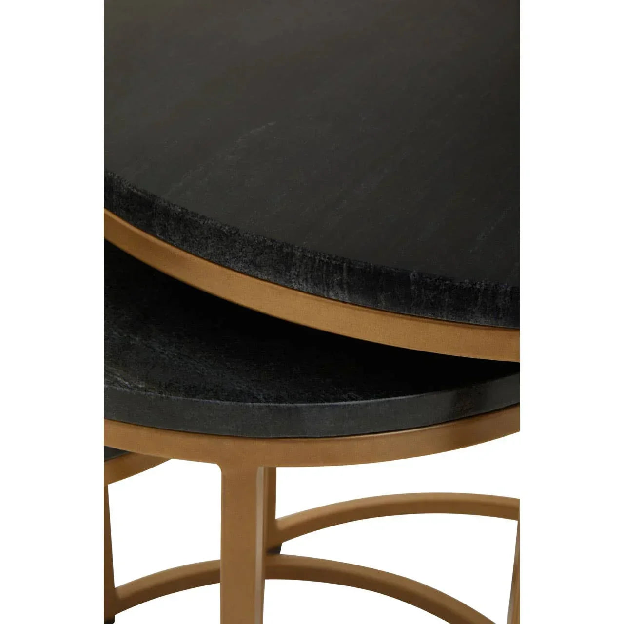 black round nesting coffee tables with gold metal frames close up