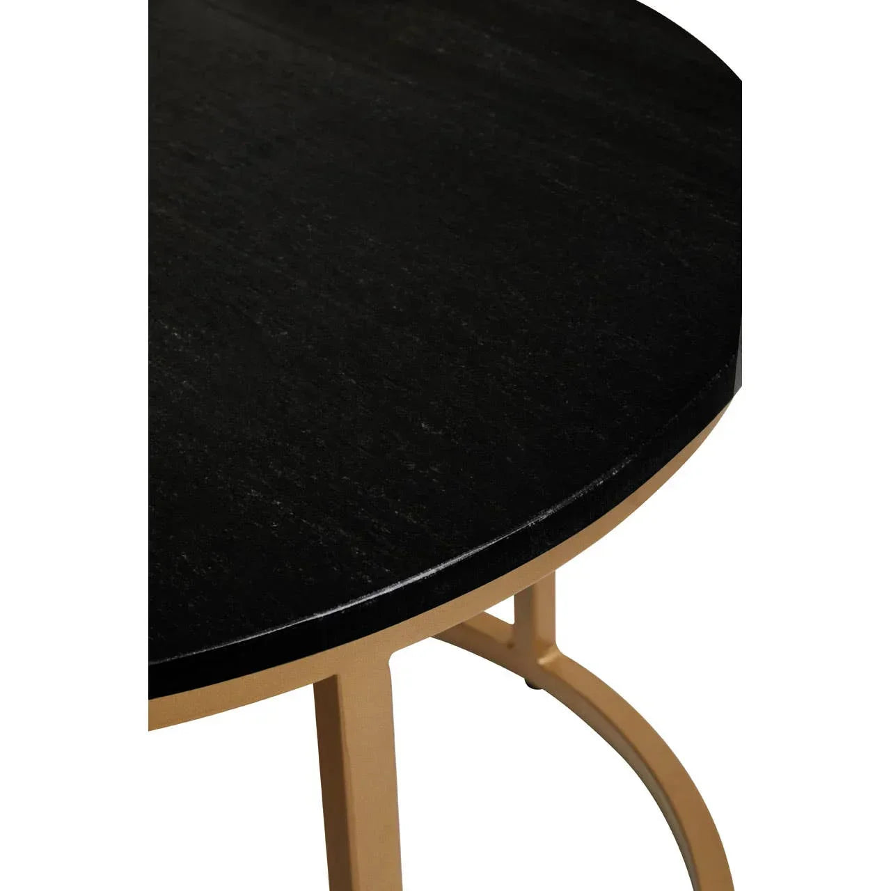 Round black dining table with gold metal legs, close-up of tabletop and frame detail