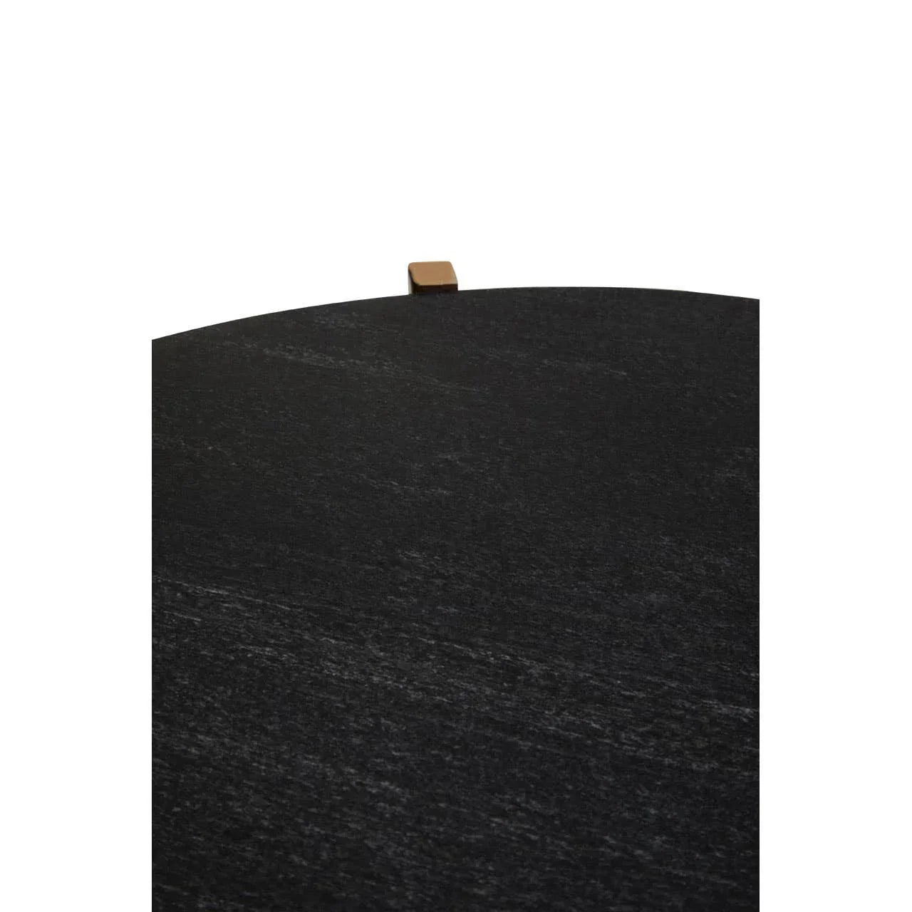 Round black table top with visible wood grain and small square brass accent